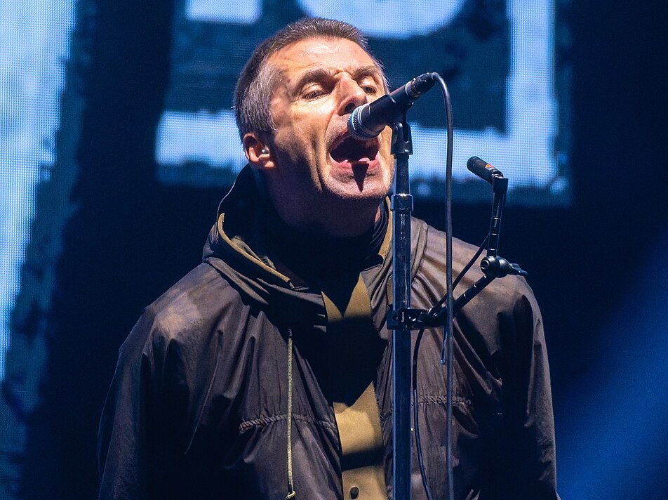 Liam Gallagher of Oasis singing on stage
